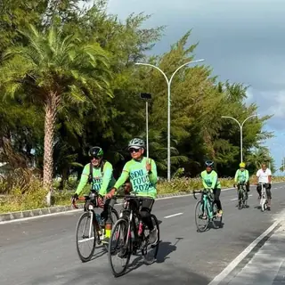 Riders on an island road in Addu