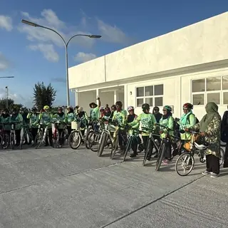 Long line of riders with their bikes in Addu
