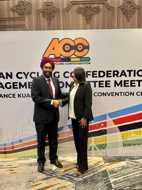 Bike Maldives and ACC officials in front of the ACC Management Committee backdrop