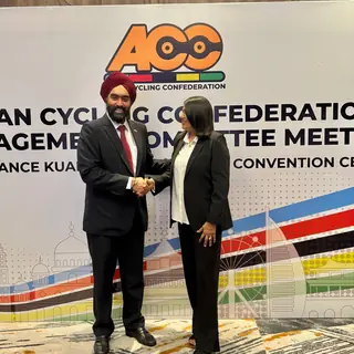 Bike Maldives and ACC officials in front of the ACC Management Committee backdrop