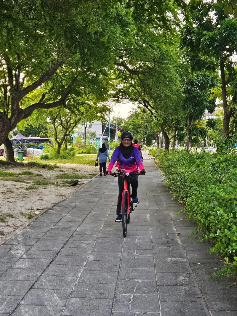 Rider on a leafy park path