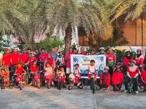 Group with a World Bicycle Day banner