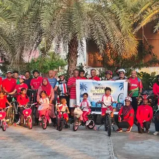 Group with a World Bicycle Day banner